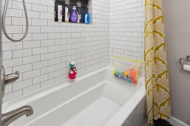 bathroom featuring shower / bath combo with shower curtain