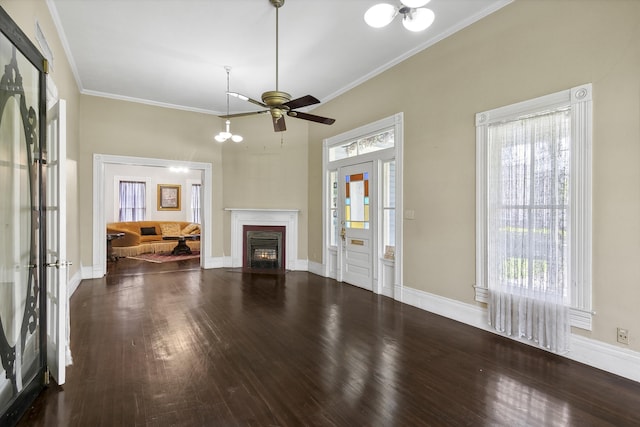 unfurnished living room with ceiling fan, dark wood-type flooring, and crown molding