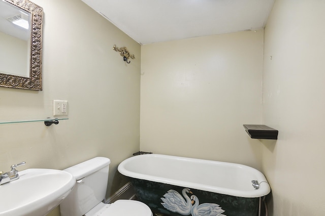 bathroom featuring sink, toilet, and a bathing tub