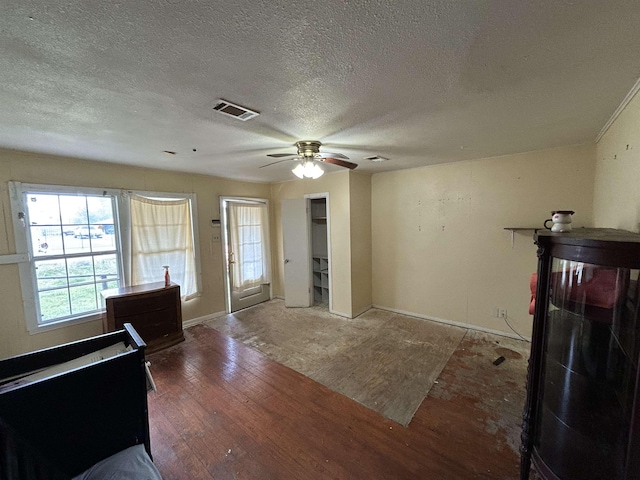 entryway featuring ceiling fan, a textured ceiling, and hardwood / wood-style flooring