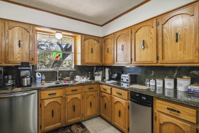 kitchen featuring dishwasher, dark stone counters, sink, light tile patterned floors, and a textured ceiling