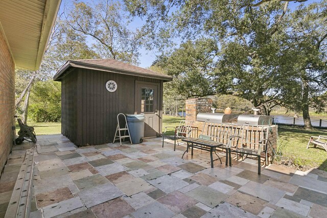 view of patio featuring an outdoor structure