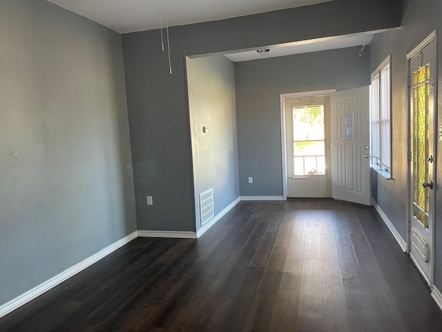 spare room with dark hardwood / wood-style floors