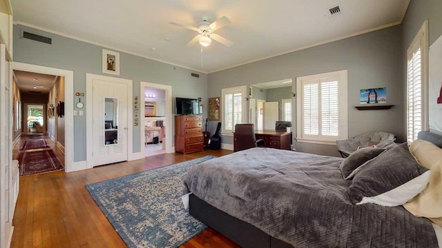 bedroom featuring dark wood-type flooring, ceiling fan, and crown molding