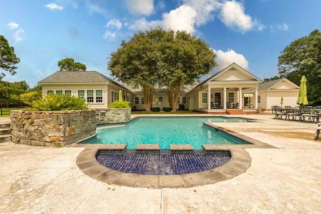 view of pool featuring a patio