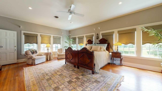 bedroom featuring hardwood / wood-style floors and ceiling fan