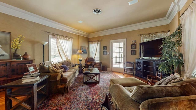 living room with hardwood / wood-style flooring and ornamental molding