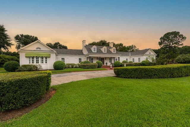 view of front of house with a lawn