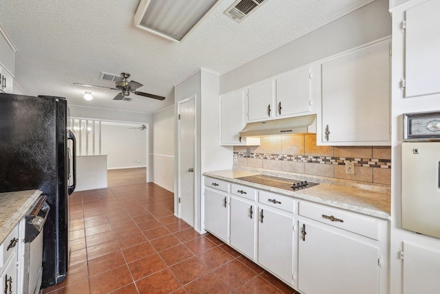 5960 Navajo Trl, Beaumont, TX 77708 - kitchen with a ceiling fan, tasteful backsplash, white cabinets, light countertops, and a textured ceiling