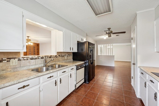 5960 Navajo Trl, Beaumont, TX 77708 - kitchen with white dishwasher, ceiling fan, a sink, decorative backsplash, and a textured ceiling