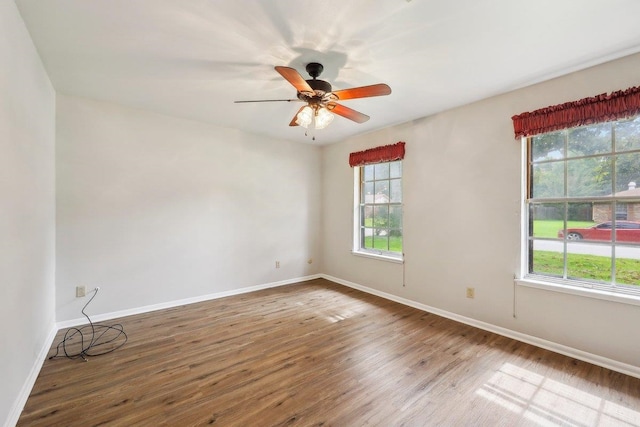 5960 Navajo Trl, Beaumont, TX 77708 - unfurnished room with plenty of natural light, wood finished floors, baseboards, and ceiling fan