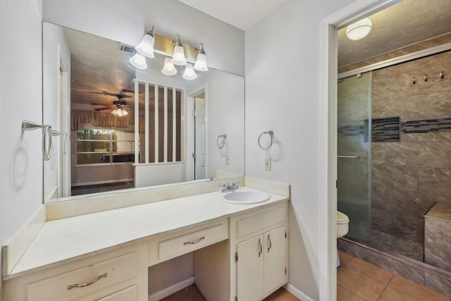 5960 Navajo Trl, Beaumont, TX 77708 - full bath featuring a stall shower, toilet, vanity, and tile patterned flooring