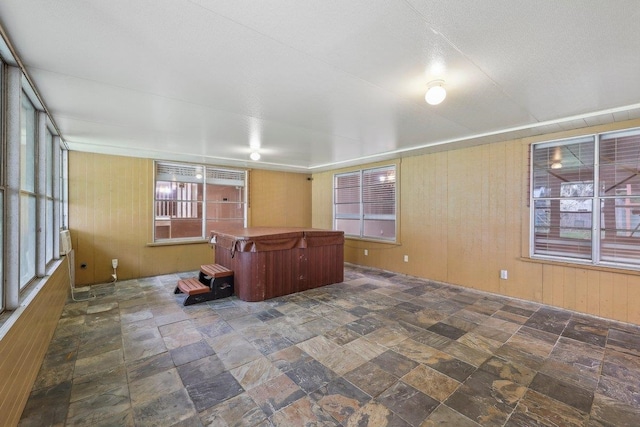 5960 Navajo Trl, Beaumont, TX 77708 - unfurnished sunroom with a hot tub and plenty of natural light