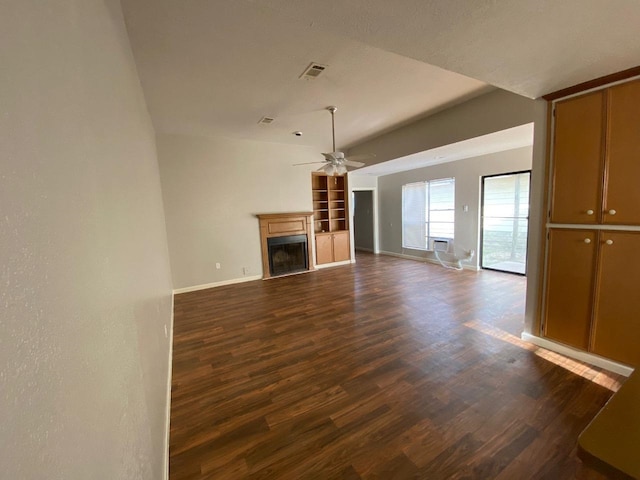 unfurnished living room featuring ceiling fan, dark wood-type flooring, and lofted ceiling