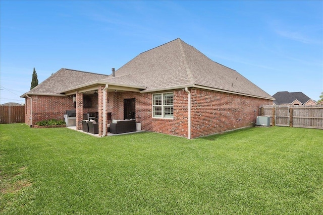 3113 Labrador Ln, Port Neches, TX 77651 - rear view of property with a fenced backyard, brick siding, an outdoor living space, a shingled roof, and a yard