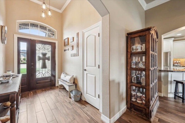 3113 Labrador Ln, Port Neches, TX 77651 - foyer with ornamental molding, arched walkways, and wood finished floors