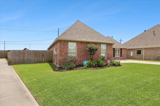 3113 Labrador Ln, Port Neches, TX 77651 - view of side of property featuring fence, a shingled roof, brick siding, concrete driveway, and a yard