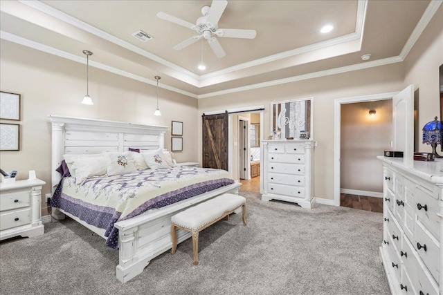 3113 Labrador Ln, Port Neches, TX 77651 - bedroom with a barn door, carpet, a tray ceiling, visible vents, and ornamental molding