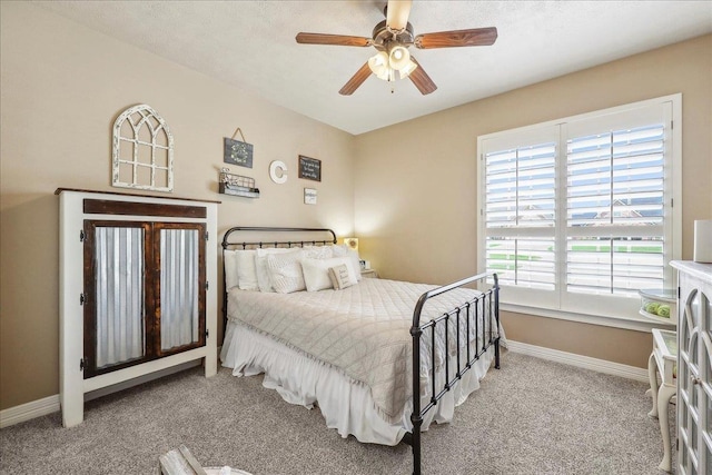 3113 Labrador Ln, Port Neches, TX 77651 - bedroom with carpet flooring, a ceiling fan, and baseboards