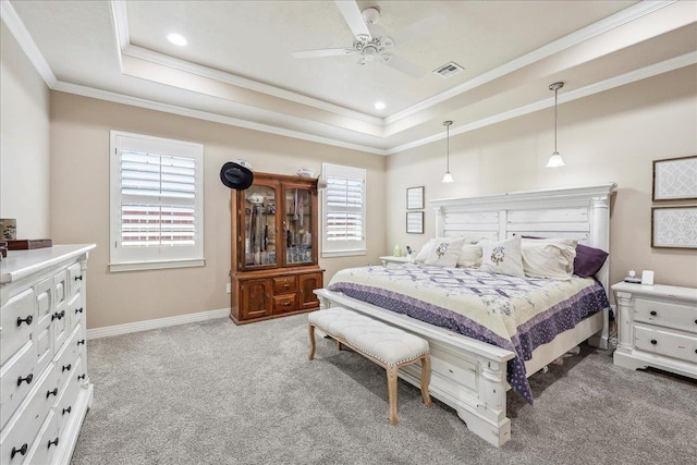 3113 Labrador Ln, Port Neches, TX 77651 - bedroom featuring ornamental molding, a tray ceiling, light colored carpet, and visible vents
