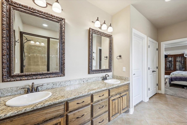 3113 Labrador Ln, Port Neches, TX 77651 - bathroom featuring double vanity, a sink, tile patterned flooring, and a stall shower