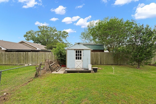 view of shed with a fenced backyard