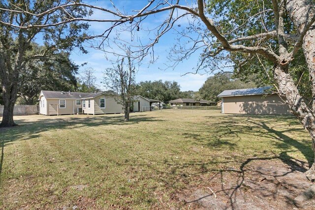 view of yard with a storage unit