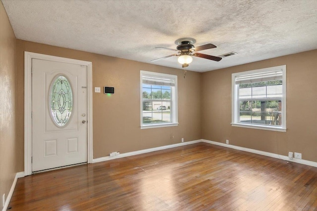 foyer with ceiling fan and hardwood / wood-style flooring