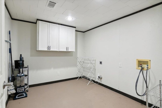 clothes washing area with electric dryer hookup, crown molding, hookup for a washing machine, and cabinets