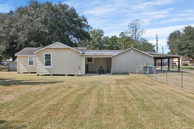 back of house with a yard