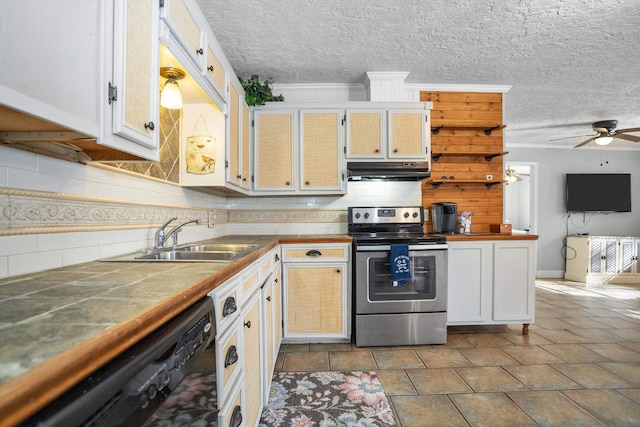 kitchen with stainless steel range with electric cooktop, sink, ceiling fan, black dishwasher, and tile counters