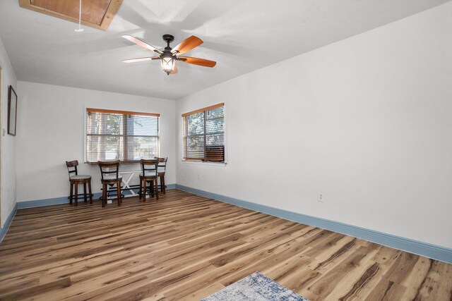 dining room with ceiling fan and wood-type flooring