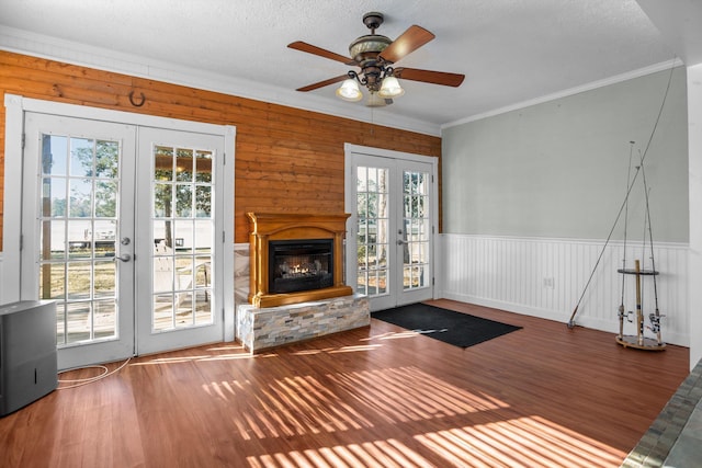 interior space featuring french doors, crown molding, ceiling fan, and a healthy amount of sunlight