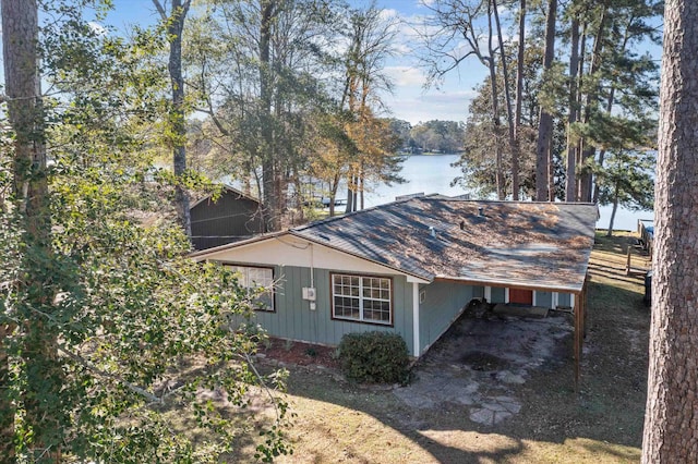 view of property exterior featuring a water view