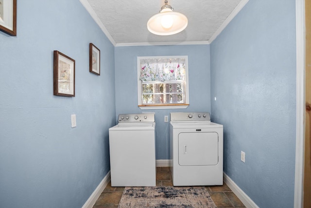 laundry room with independent washer and dryer, a textured ceiling, and crown molding