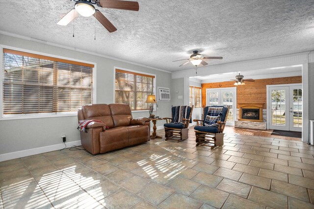 living room featuring french doors, ceiling fan, and ornamental molding