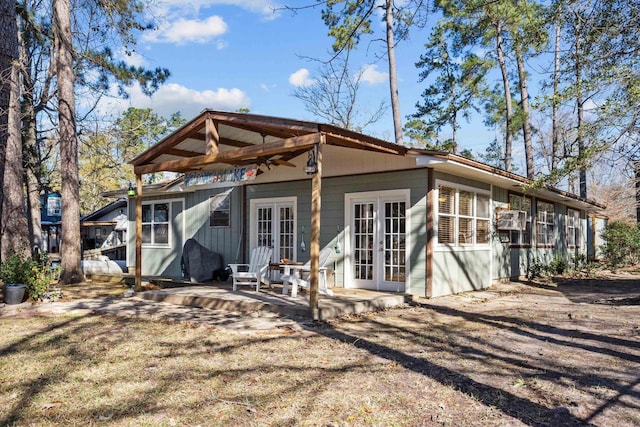 rear view of property featuring french doors and a patio