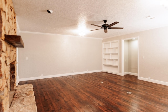 interior space with built in features, dark hardwood / wood-style flooring, ceiling fan, crown molding, and a textured ceiling