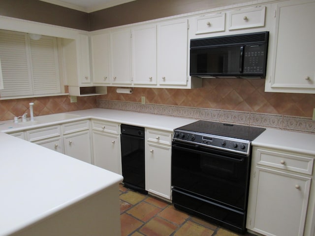 kitchen featuring tasteful backsplash, light countertops, a sink, and black appliances