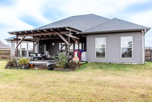 back of house with a lawn and a patio area