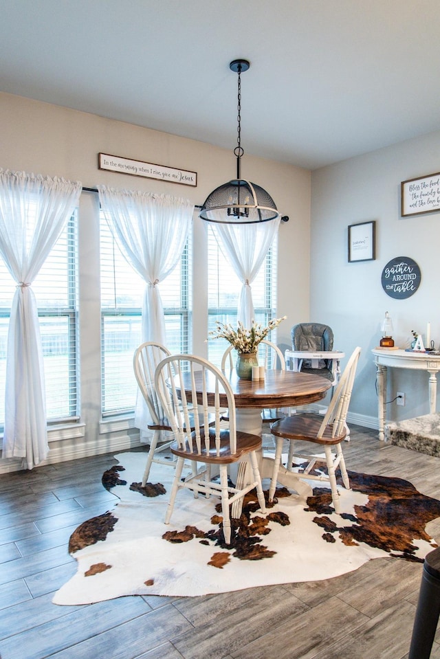 dining area featuring a chandelier and a wealth of natural light