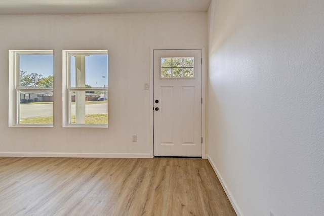 entryway with light hardwood / wood-style floors