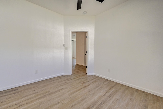 spare room with light hardwood / wood-style floors and ceiling fan