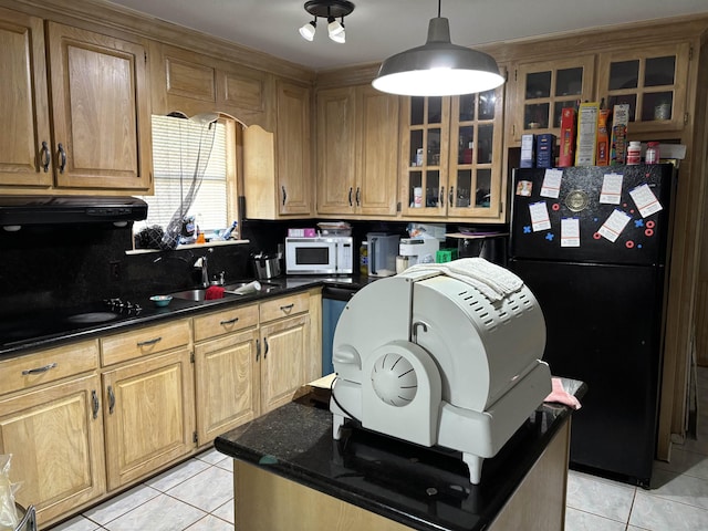 kitchen with dark countertops, ventilation hood, black appliances, and light tile patterned flooring