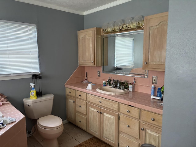 bathroom featuring plenty of natural light, crown molding, toilet, and vanity