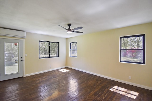unfurnished room featuring baseboards, a wall mounted AC, ceiling fan, and wood-type flooring