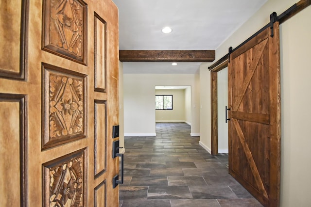 hall featuring beam ceiling, recessed lighting, baseboards, and a barn door