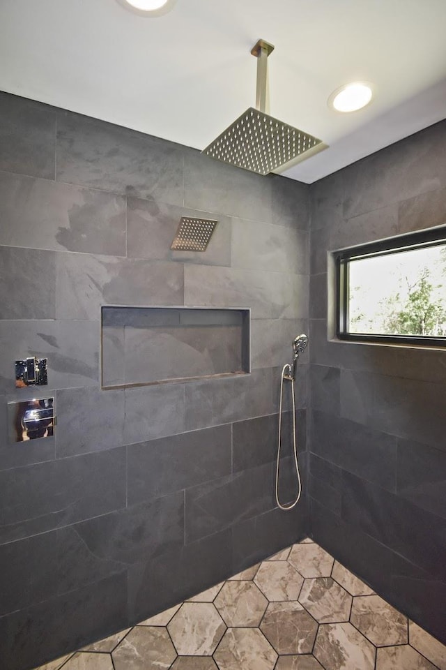 bathroom with tiled shower