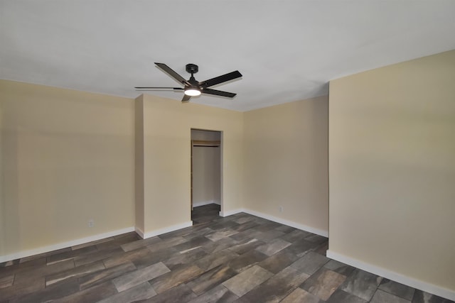 unfurnished bedroom with baseboards, a closet, and ceiling fan
