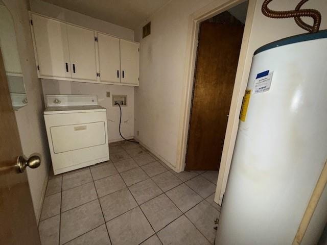 laundry room with water heater, washer / clothes dryer, cabinet space, and light tile patterned floors
